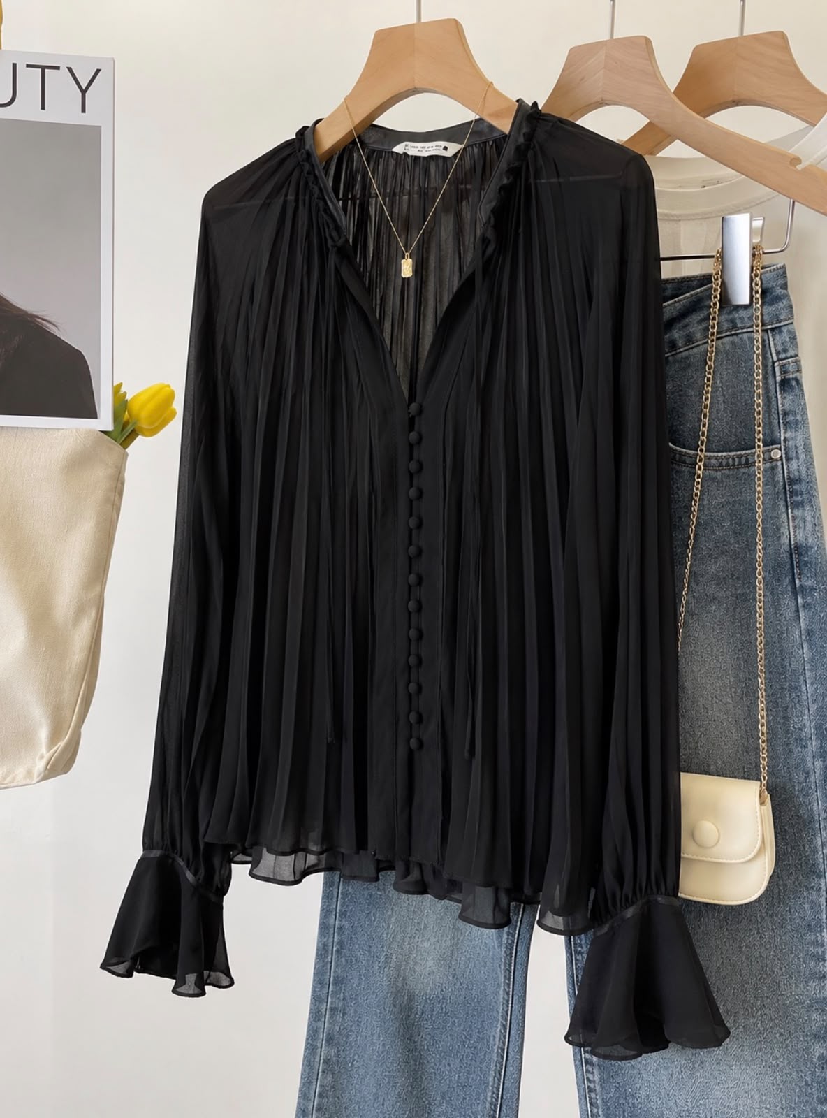 Zara's black flowy blouse